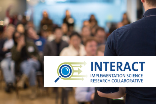 INTERACT Logo against a stock image background of a speaker standing in front of a lecture hall full of students
